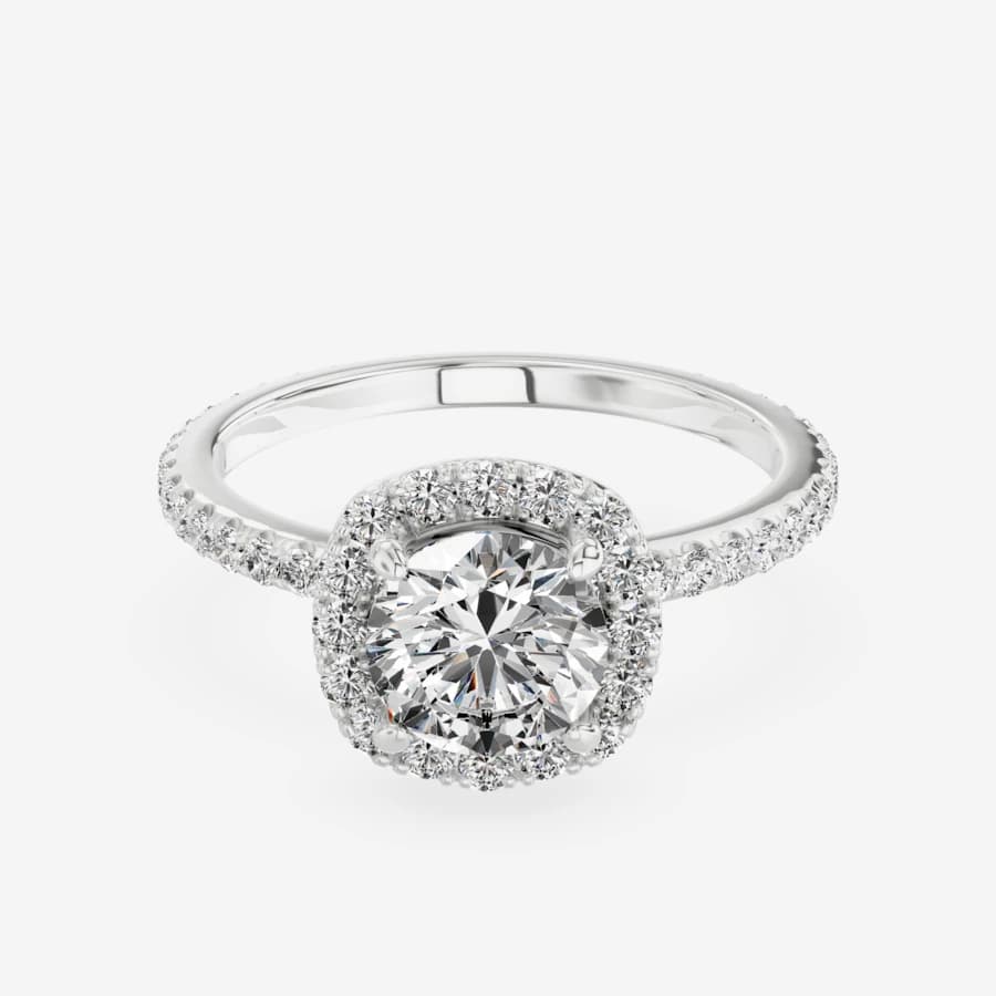 The same halo ring rendered in white gold, same pose and lighting