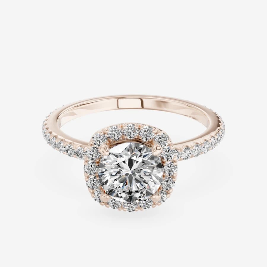 The same halo ring rendered in rose gold, same pose and lighting